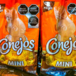 Two orange packages of the Mexican candy Conejos, a brand of rabbit-shaped chocolates, for sale in Puerto Escondido, Oaxaca.